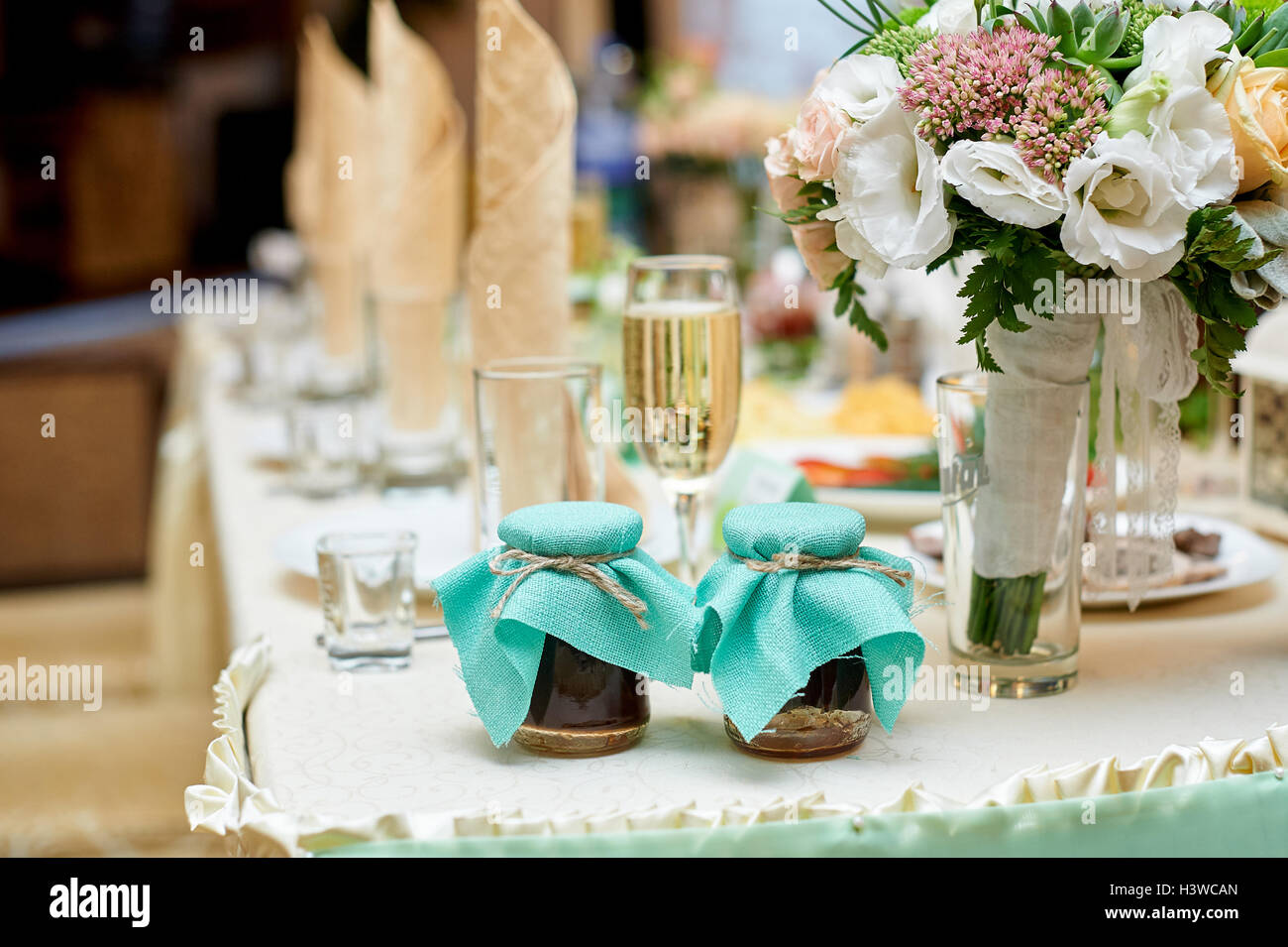 wedding table decorated with flowers in restaurant Stock Photo