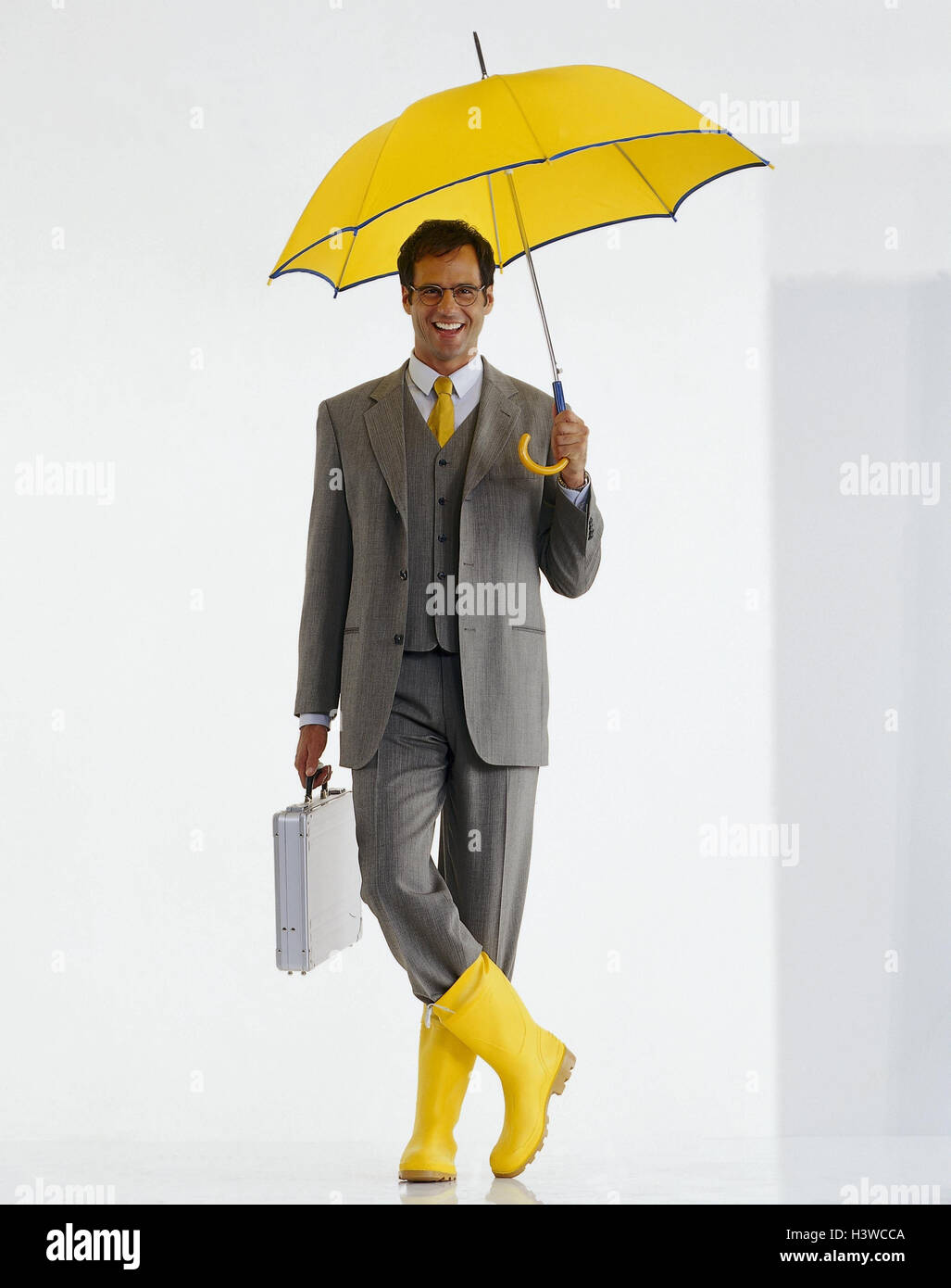 Businessman, young, careless, briefcase, umbrella, wellington, professions, studio, cut out, rain, weatherproofly, bad weather, man, Stock Photo