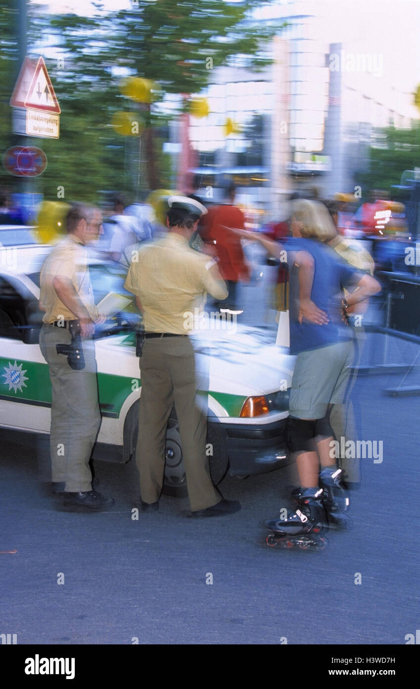 Acquisition accident data, policeman, Inlineskaterin, conversation, town, street, tape, police tape, film police, police car, men, officials, uniform, woman, Inlineskates, accident, danger situation, protocol, record, explanation, information, clarificati Stock Photo