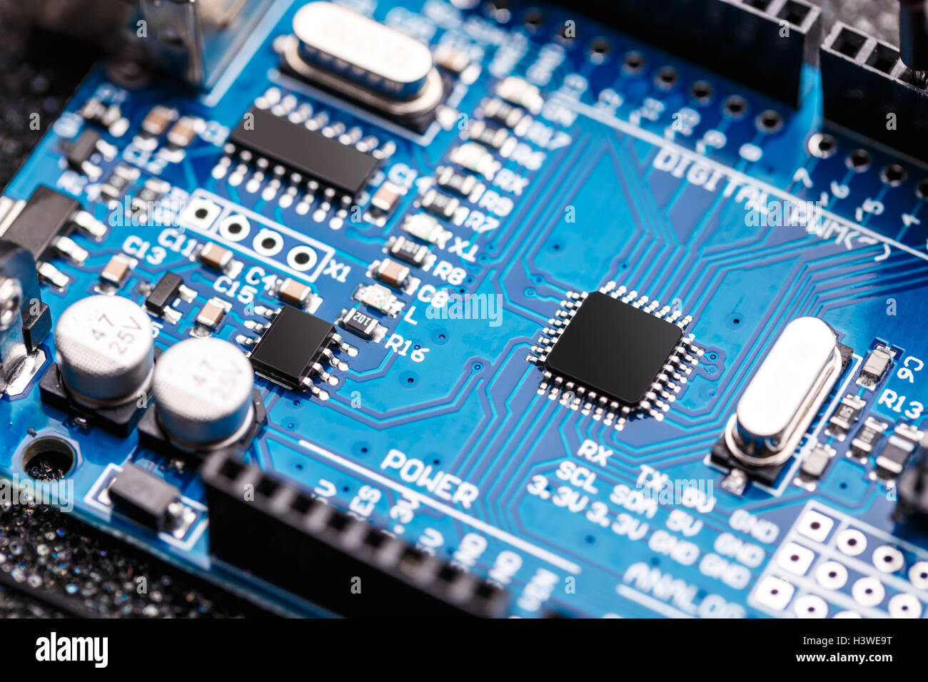 Integrated semiconductor microchip/ microprocessor on blue circuit board Stock Photo