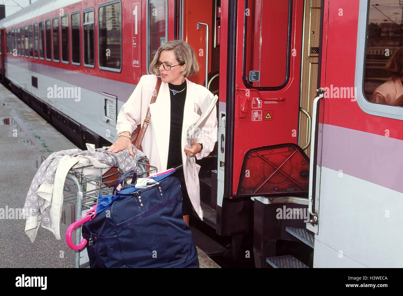 https://c8.alamy.com/comp/H3WECA/platform-woman-luggage-railway-station-train-travellers-go-away-to-H3WECA.jpg