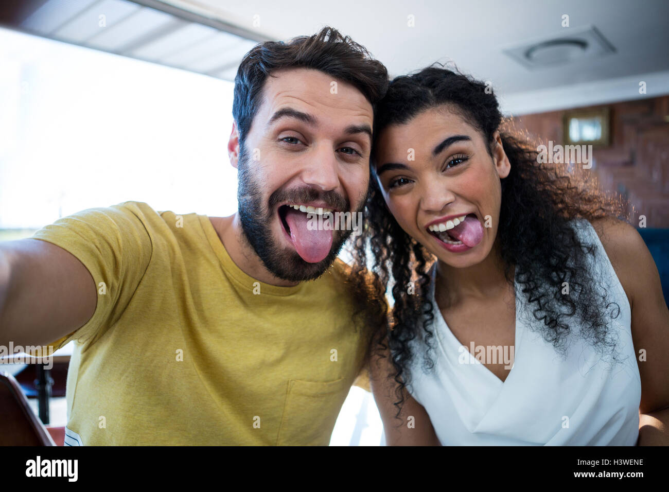 Couple making facial expression and having fun Stock Photo