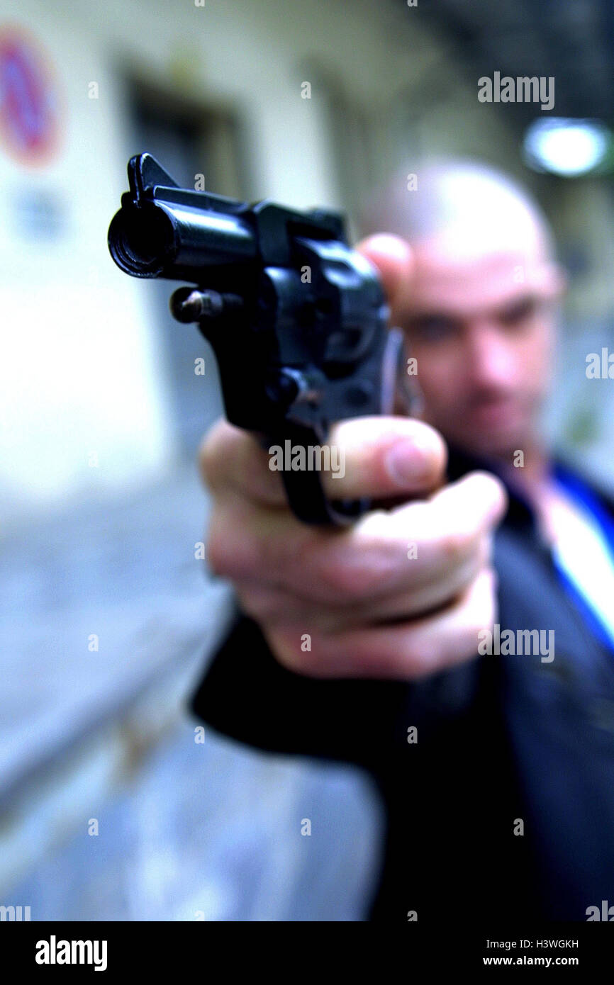 Man, revolver, gesture, aim, threaten threat, blur, close up, criminal activity, criminal, criminal, readiness for violence, power, colt, firearm, weapon, hand-held weapon, threat, danger, aggression, attack, threat, raid, violent criminal, criminal offen Stock Photo