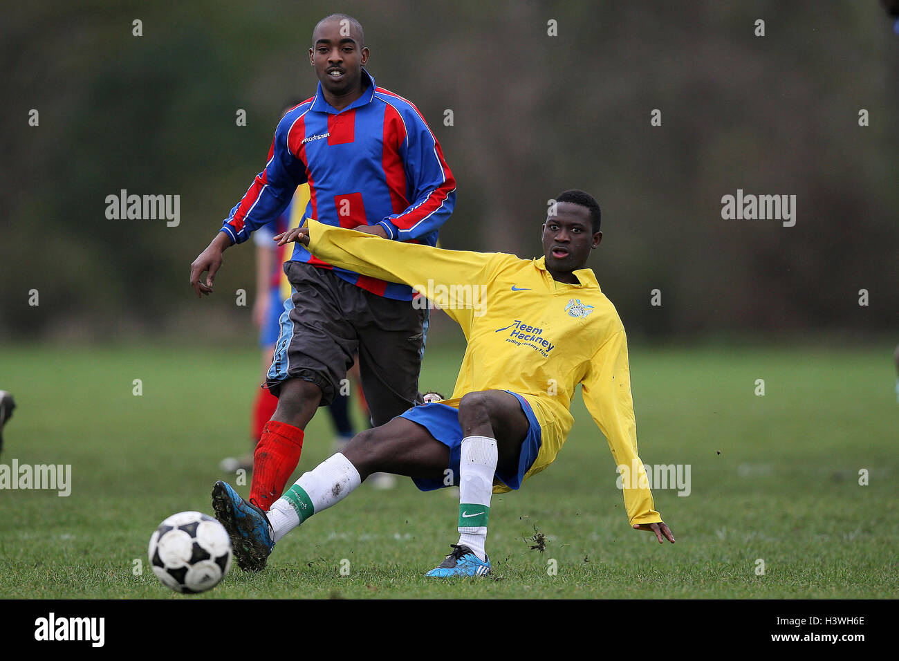 Clapton Rangers (yellow) vs Crownfield (red/blue) - East London Sunday League Football at South Marsh, Hackney Marshes - 21/11/10 Stock Photo