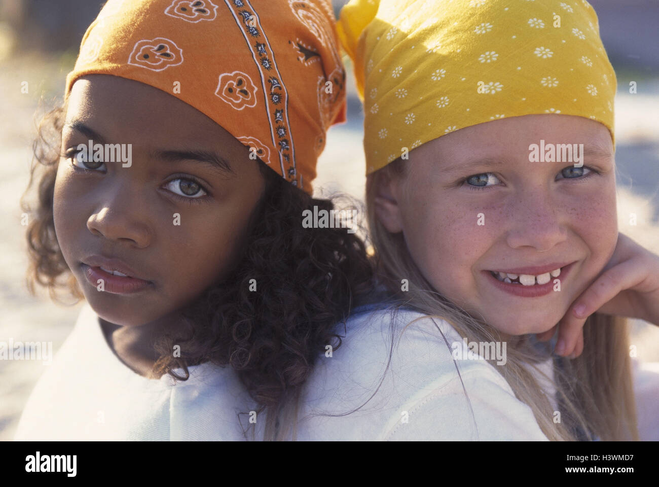Girls, different colour of skin, headscarfs, portrait, friends, friendship, friends, nationality, differently, non-whites, whiteness, children, childhood, headgears, back on back, fun, happy, together, cohesion, view camera, outside Stock Photo