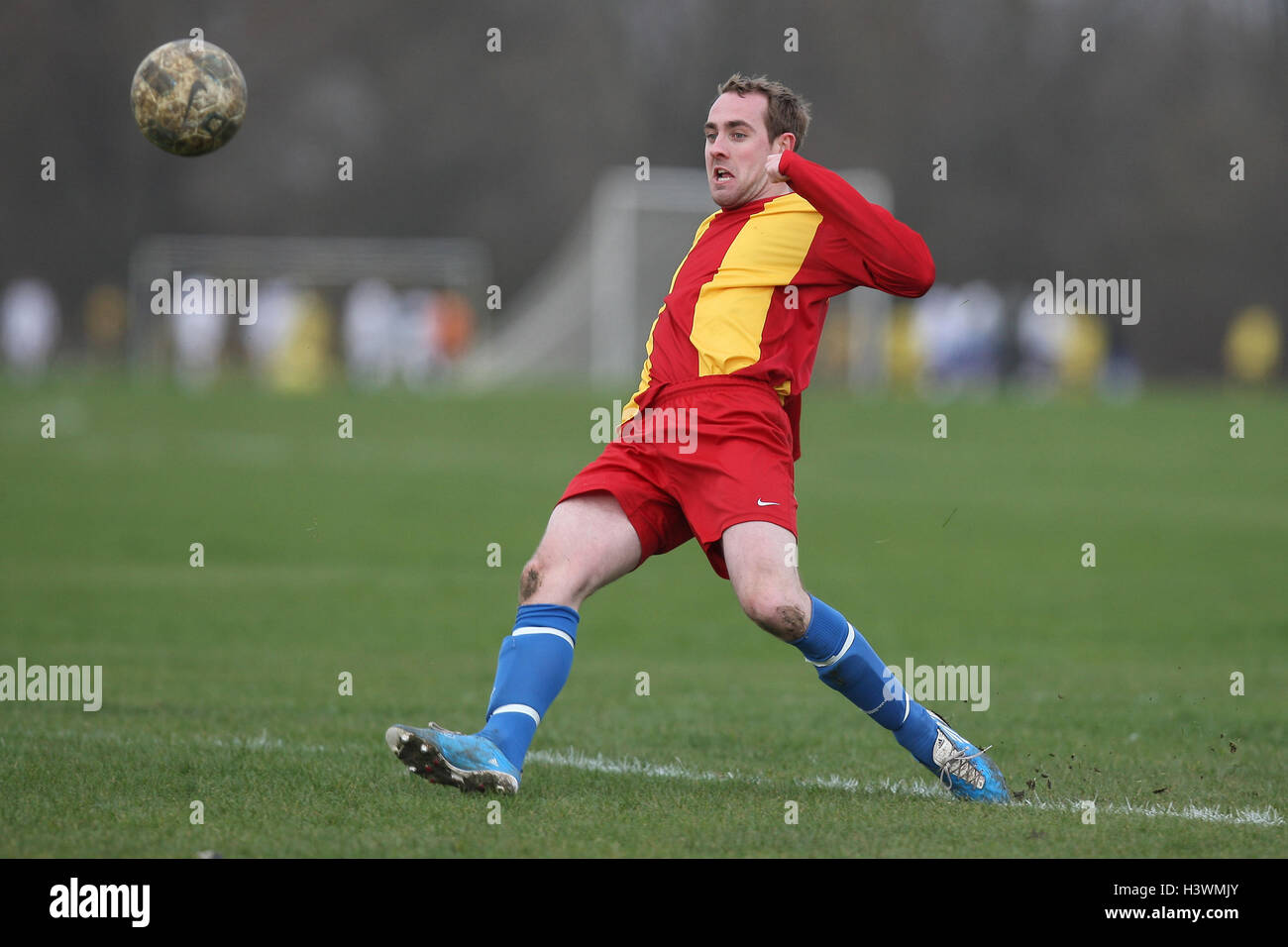 Zeppelin score their first goal - Zeppelin (red/yellow) vs Clapton Rangers (yellow/blue) - East London Sunday League Football at South Marsh, Hackney Marshes - Essex Senior League Football at the Mile End Stadium - 06/03/11 Stock Photo