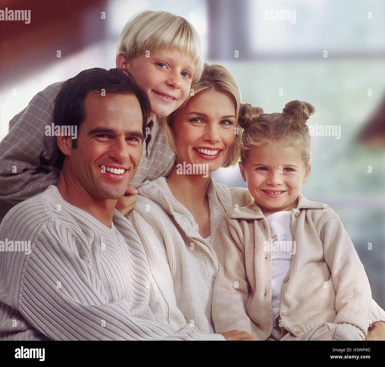 Family, laugh, group picture Families, couple, man, woman, parents, children, two, boy, girl, son, subsidiary, siblings, clothes, colour shade, immediately, beige, embrace, side by side, one after the other, happy, inside, near, Stock Photo