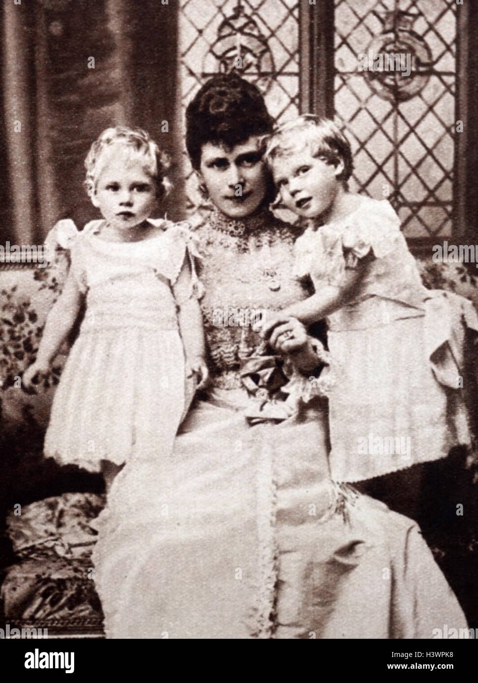 Photographic portrait of the Duchess of York (1867-1953) who later became Mary of Teck, Prince Albert (1895-1952) and Prince Edward (1894-1972). Dated 19th Century Stock Photo