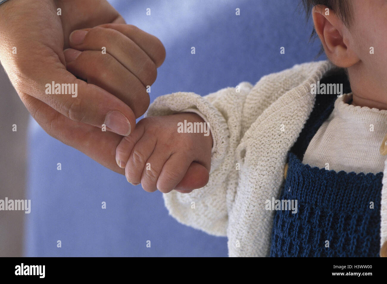 Baby, lie, detail, hand, nut, finger, stick, at home, woman, women's hand, child, baby hand, affection, tenderness, affectionately, touch, touch, feel, hold, clinch, clip Stock Photo
