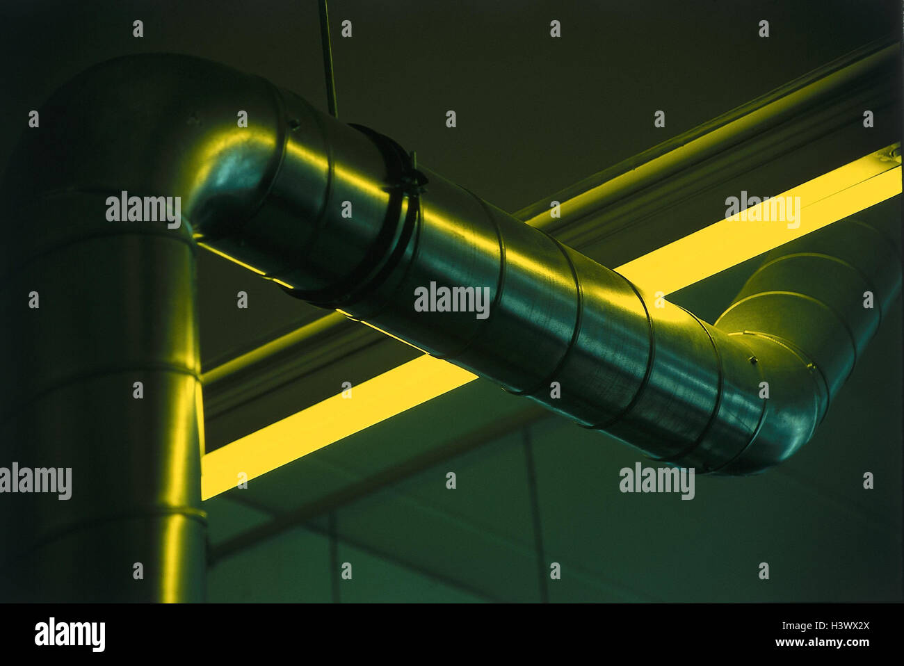 Printers, pressure plate exposure, detail, air pipe, yellow light exposure, light, yellow, air shaft, ventilation, pipe, exhaust air, product photography, Germany, Bavaria, Wemding Stock Photo