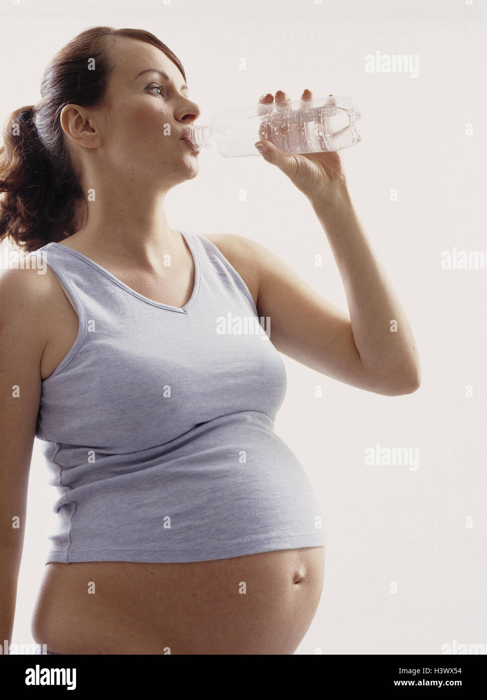 Woman, pregnant, water Bottle, drink, model released, studio, cut out