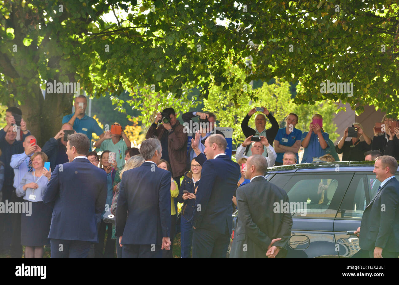 The Duke of Cambridge waves the waiting crowds  as he leaves after  an official visit to  a Step into Health programme at the Ark Conference Center Basingstoke and North Hampshire Hospital focusing on work to provide employment opportunities for military veterans. The Duke will gain further insight into the @StepIntoHealth programme and meet some of its current participants and graduates Credit:  Gary Blake/Alamy Live News Stock Photo