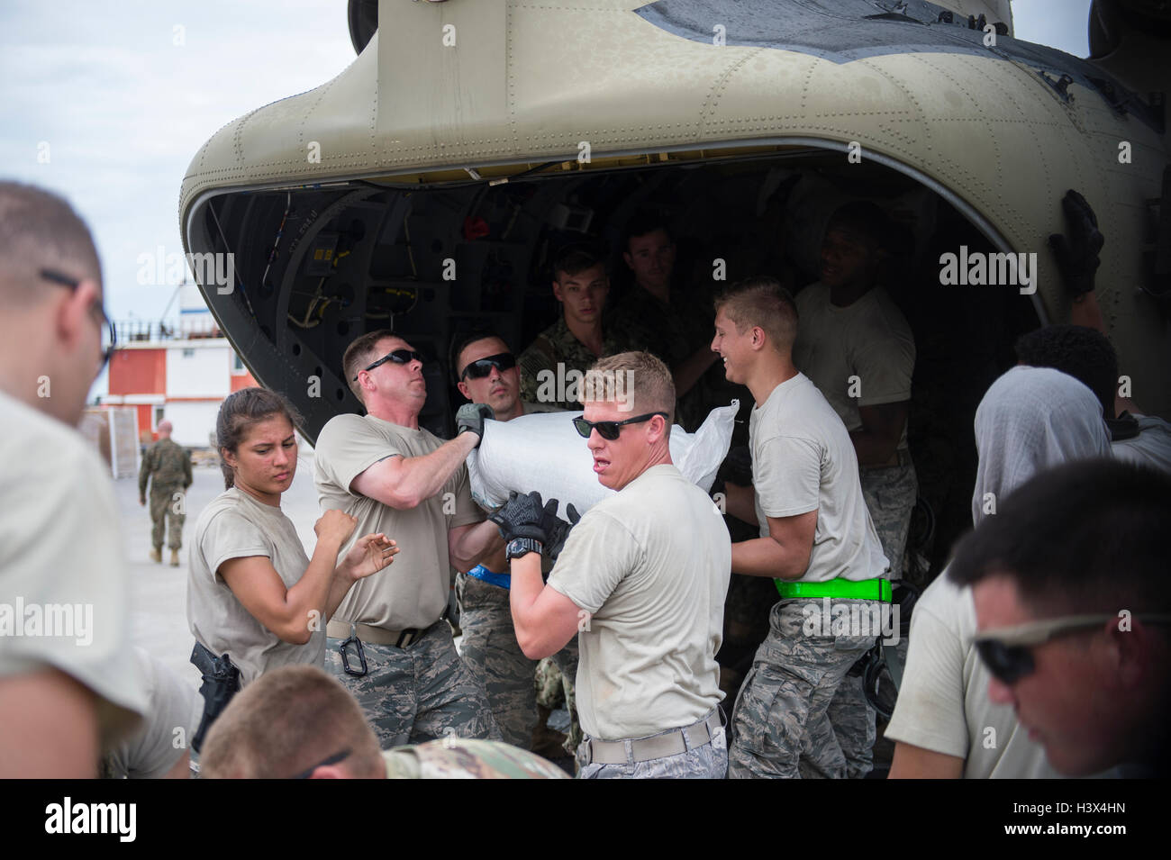 Dame Marie, Haiti. 12th October, 2016. U.S service members unload humanitarian relief supplies for Haitians affected by Hurricane Matthew October 12, 2016 in Port-au-Prince, Haiti. Hurricane Matthew struck Haiti with winds over 140-mph killing 500 people and causing widespread damage. Credit:  Planetpix/Alamy Live News Stock Photo