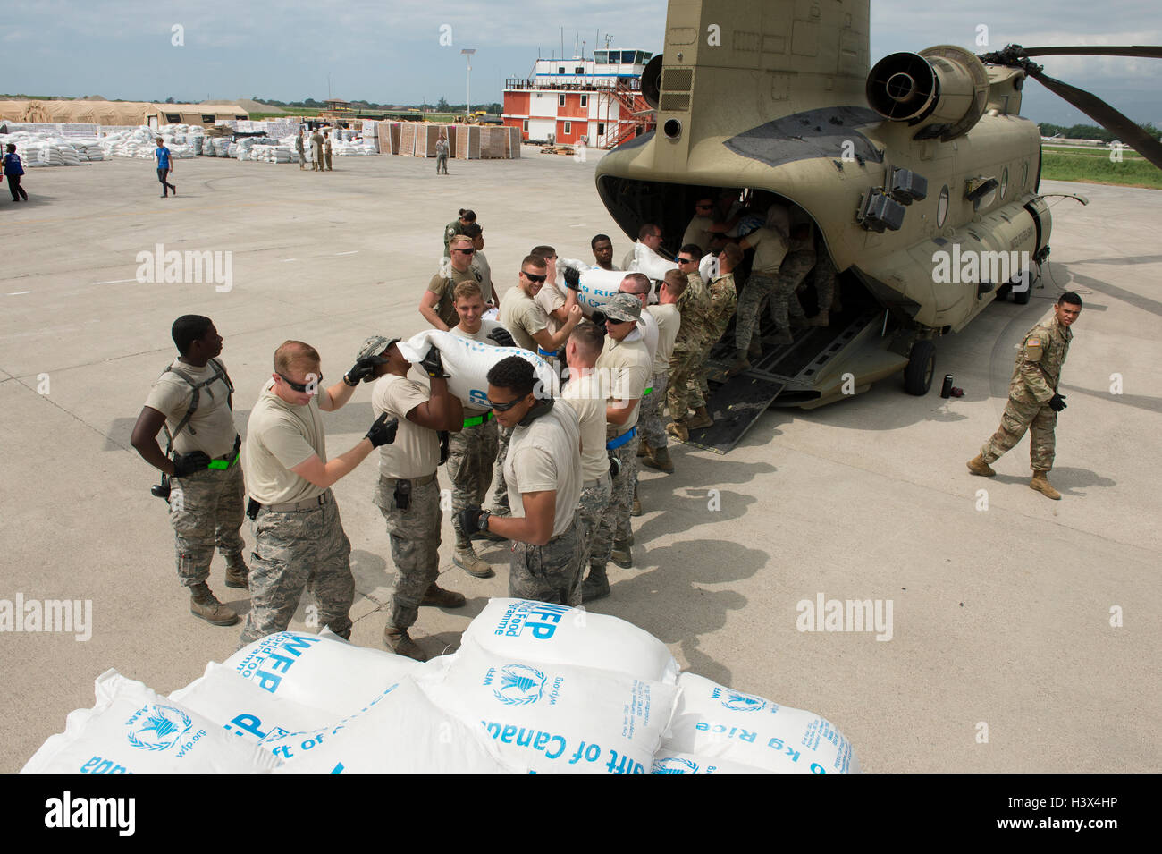 Dame Marie, Haiti. 12th October, 2016. U.S service members unload humanitarian relief supplies for Haitians affected by Hurricane Matthew October 12, 2016 in Port-au-Prince, Haiti. Hurricane Matthew struck Haiti with winds over 140-mph killing 500 people and causing widespread damage. Credit:  Planetpix/Alamy Live News Stock Photo