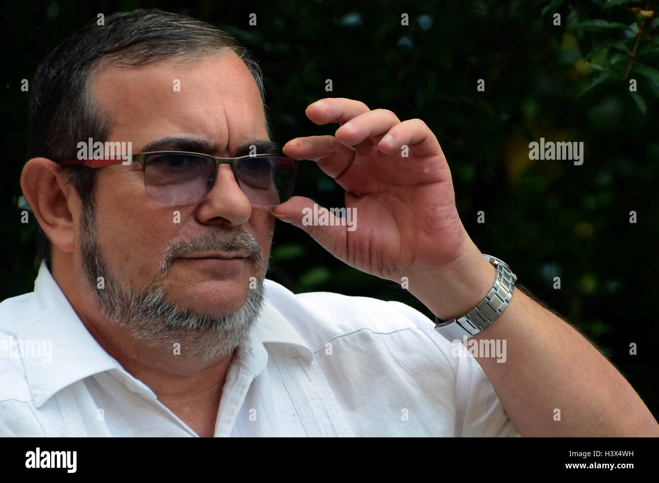 Havana, Cuba. 11th Oct, 2016. Top leader of the Revolutionary Armed Forces of Colombia (FARC) Rodrigo Londono, also known as Timoleon Jimenez, gestures during an exclusive interview with Xinhua in Havana, Cuba, Oct. 11, 2016. FARC is willing to talk with different political sectors to enrich the peace agreement which he and Colombian President Juan Manuel Santos have signed, Rodrigo Londono said, refusing to renegotiate the agreement. © Joaquin Hernandez/Xinhua/Alamy Live News Stock Photo