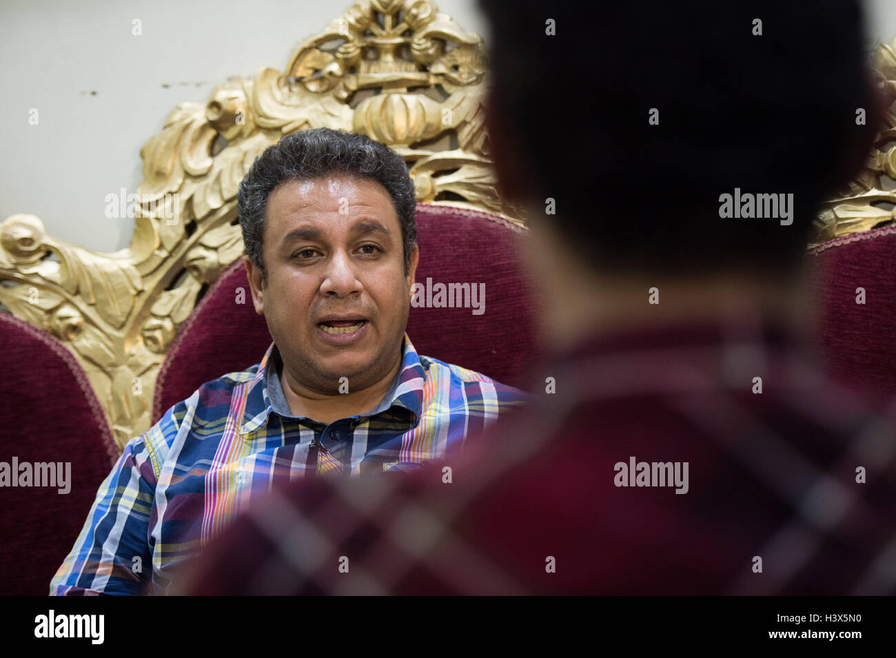 Assiut, Egypt. 10th Oct, 2016. Khaled Mansour, pharmacist and organizer of the Miss Upper Egypt contest, speaks during an interview with Xinhua in Assiut, Egypt, Oct. 10, 2016. Women in Egypt, particularly those in male-dominant, conservative south, struggle to rise as effective and independent elements of society through education, work and social activities, including the recent attempt to hold the first Miss Upper Egypt competition despite social, tribal and traditional rejection. © Meng Tao/Xinhua/Alamy Live News Stock Photo