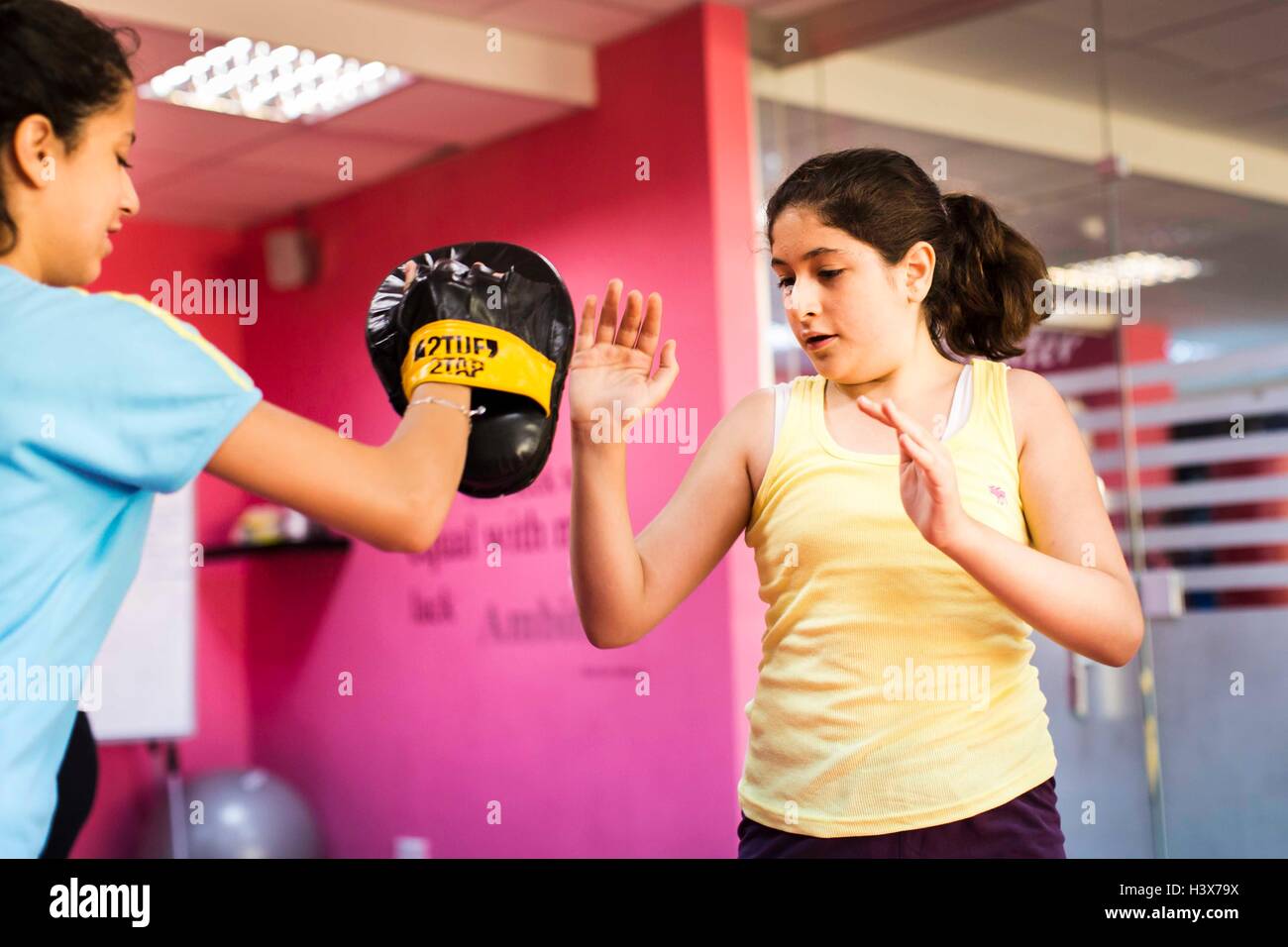 Amman Amman Jordan. 21st Aug 2015. Reem Habib and Sana Kayyali practice different punching and kicking techniques in a self defense course at She Fighter in Amman Jordan on August 21 2015