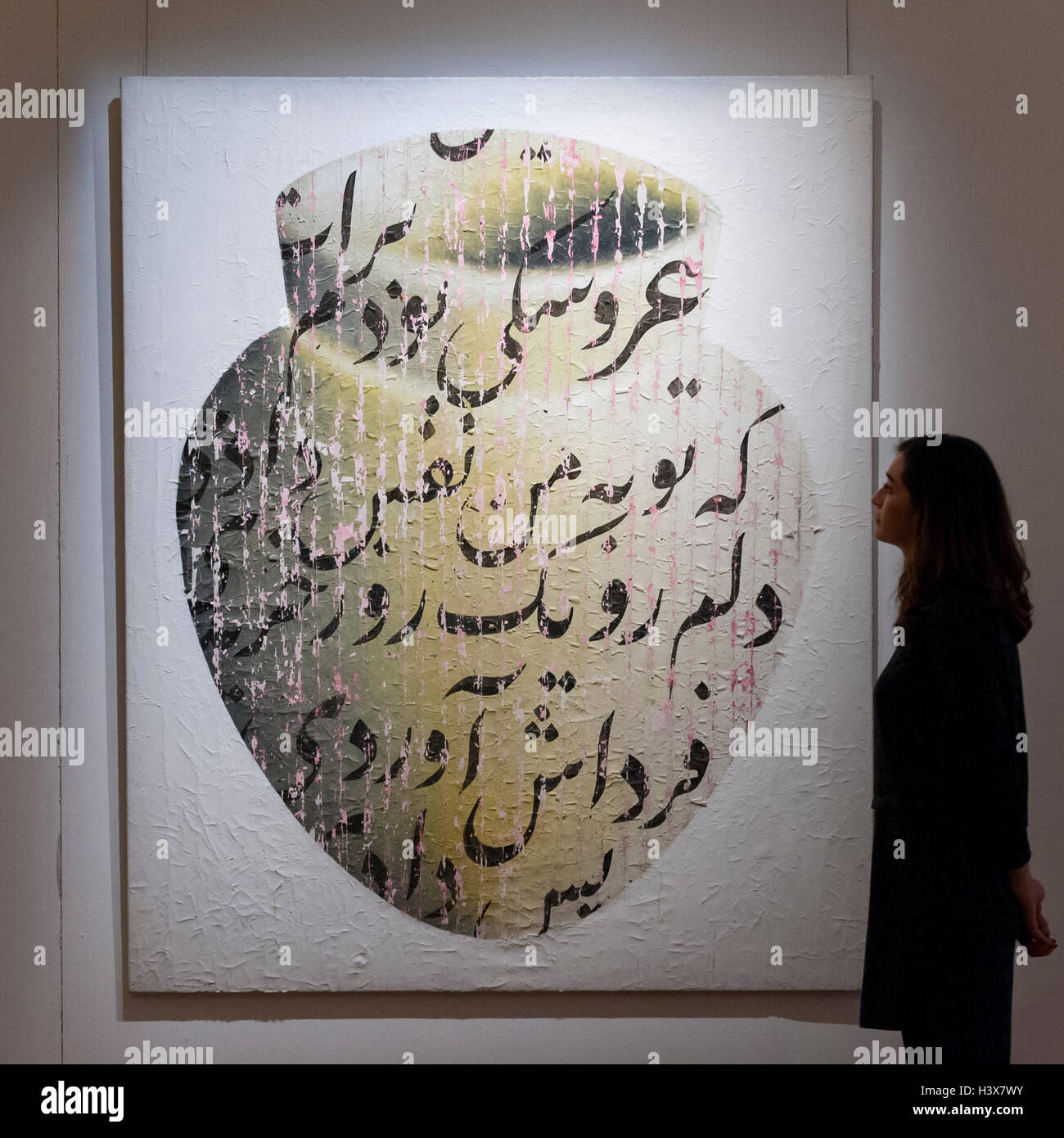 London, UK.  13 October 2016. A Sotheby's staff member views 'For You I Was a Puppet, You Gave Me Breath ... , 2003' by Farhad Moshiri (est. GBP 80-100k) at the preview of Sotheby's Art of the Middle East and India exhibition, which presents artworks to be sold in New Bond Street in four sales in October covering Modern & Contemporary South Asian Art, 20th Century Middle Eastern Art, Arts of the Islamic World and items from the Khosrovani-Diba Collection. Credit:  Stephen Chung / Alamy Live News Stock Photo