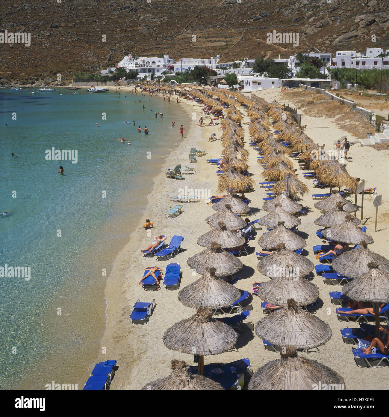 Greece, Cyclades island Mykonos, Psaru, beach, Europe, the Aegean Sea, sunshades, in accordance with originators Psarou, beach, sunshades, bathers, vacationers, hotel facility, outside Stock Photo