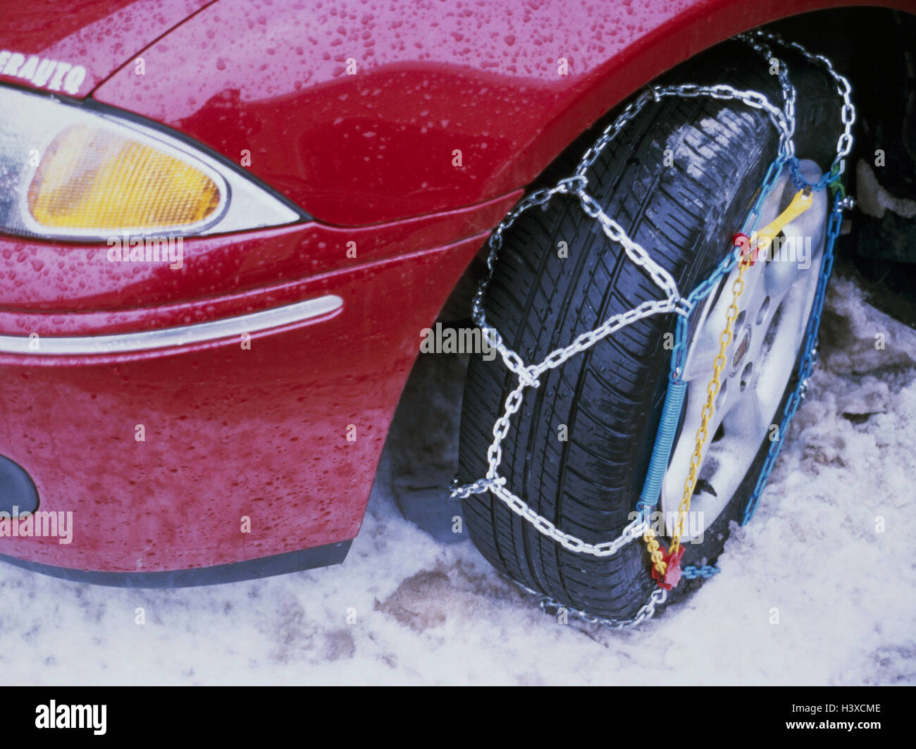 Passenger car, detail, tyre, non-skid chains, traffic, car, winter equipment, security, winter, snow, snow-covered road, wintry street relations Stock Photo