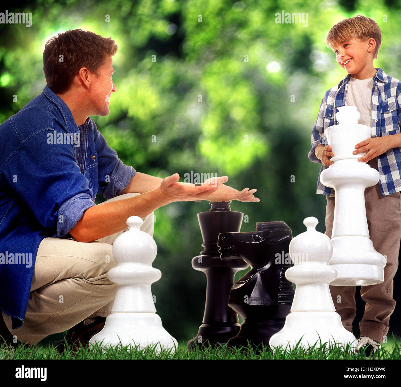 Father, son, chess pieces, oversized, game, meadow Families, man, child, boy, play, park, chess, chess, 'chessboard tactics', leisure time, outside, outsize, strategy game, manoeuvre, game figures, strategy, Stock Photo