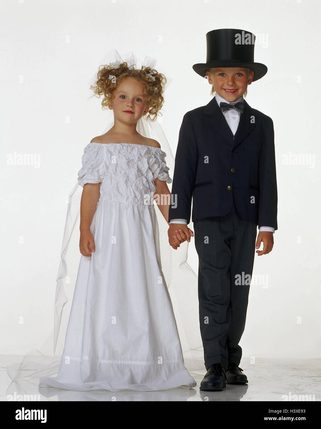 Children, bride and groom, hand in hand children, cut out, studio, inside, outside, wedding couple, wedding, marry, marriage, adult, game, play, lining Stock Photo