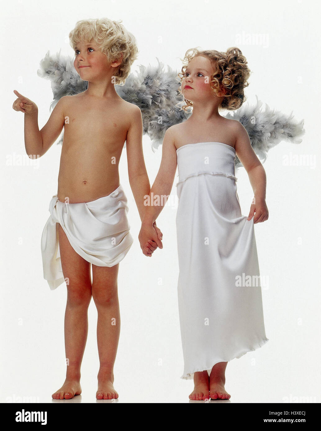 Boy, girl, angel, hand in hand, gesture, point x-mas, Christmas, children, two, curls, lining, wing, angel's wing, indicate, view, side view, look, curiosity, heaven messenger, studio, cut out, X MAS folder, Stock Photo