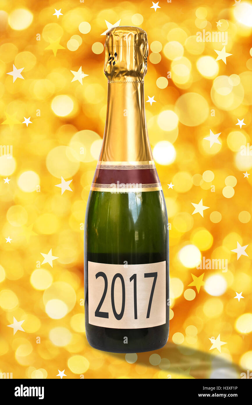 2017 on a label of a bottle of Champagne, shiny golden background, 2017 new year concept Stock Photo