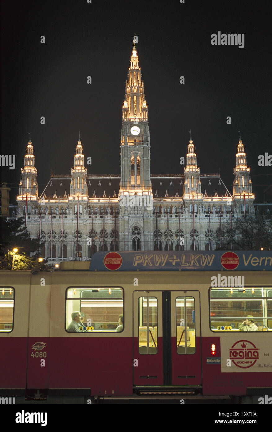 Austria, Vienna, city hall, lighting, detail, streetcar, night, Europe, capital, city hall building, structure, in 1872-83, builder Friedrich von Schmidt, architectural style, architecture, new Gothic, tower height 97.9 m, landmarks, place of interest, culture, means transportation, publicly, tram, transportation human beings, traffic, rail transport, trajectory traffic, trajectory, evening Stock Photo