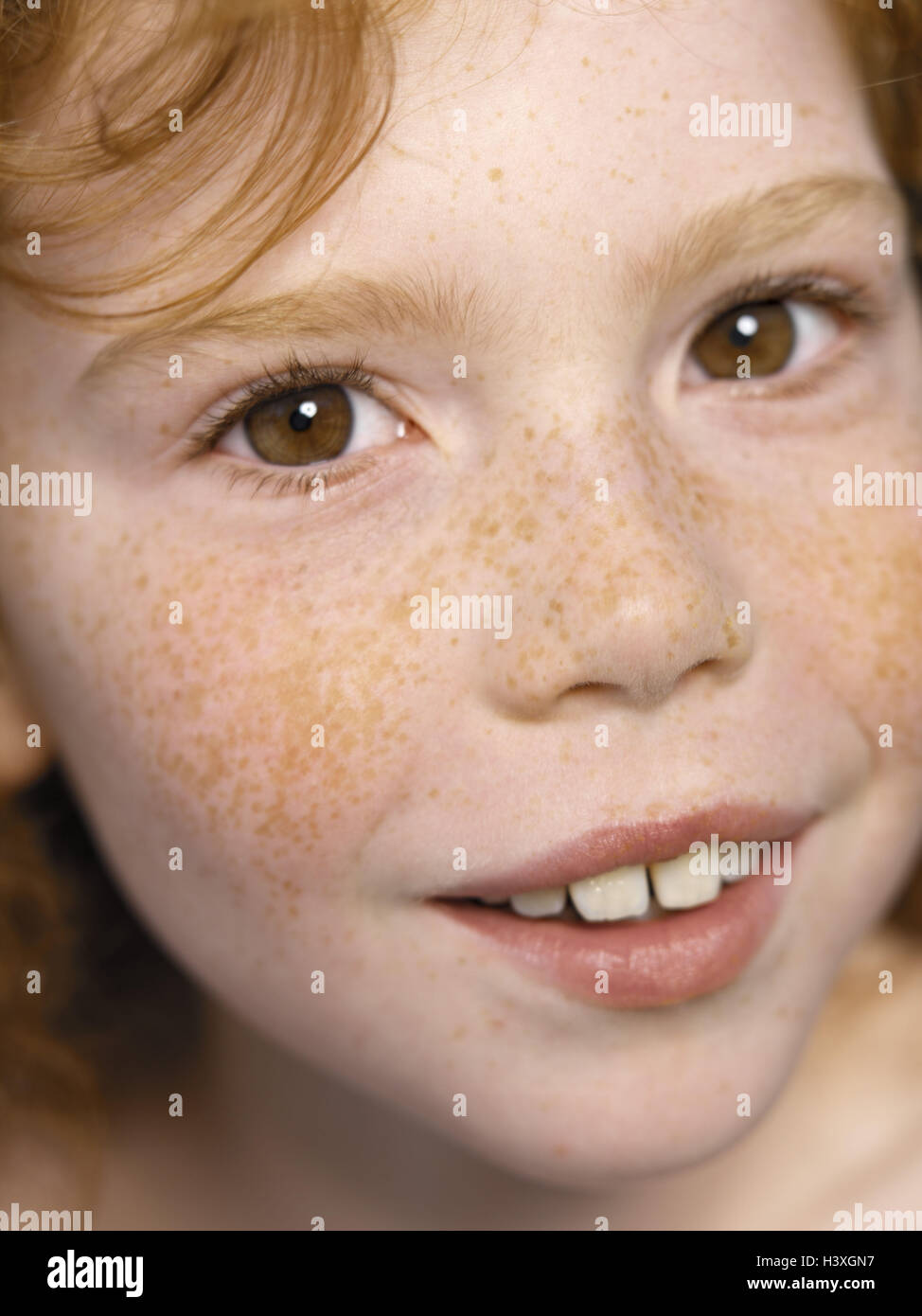 Child, girls, freckles, rehaired, smiles, cheerfully