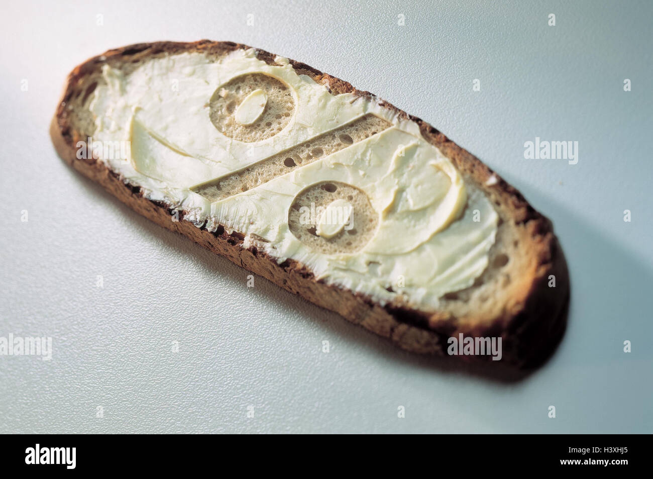 Slice bread, butter, percent sign, Still life, percent, conversion, DM, euro, differences between prices, more expensive, price increase, price reduction, cheaper, spread, studio Stock Photo