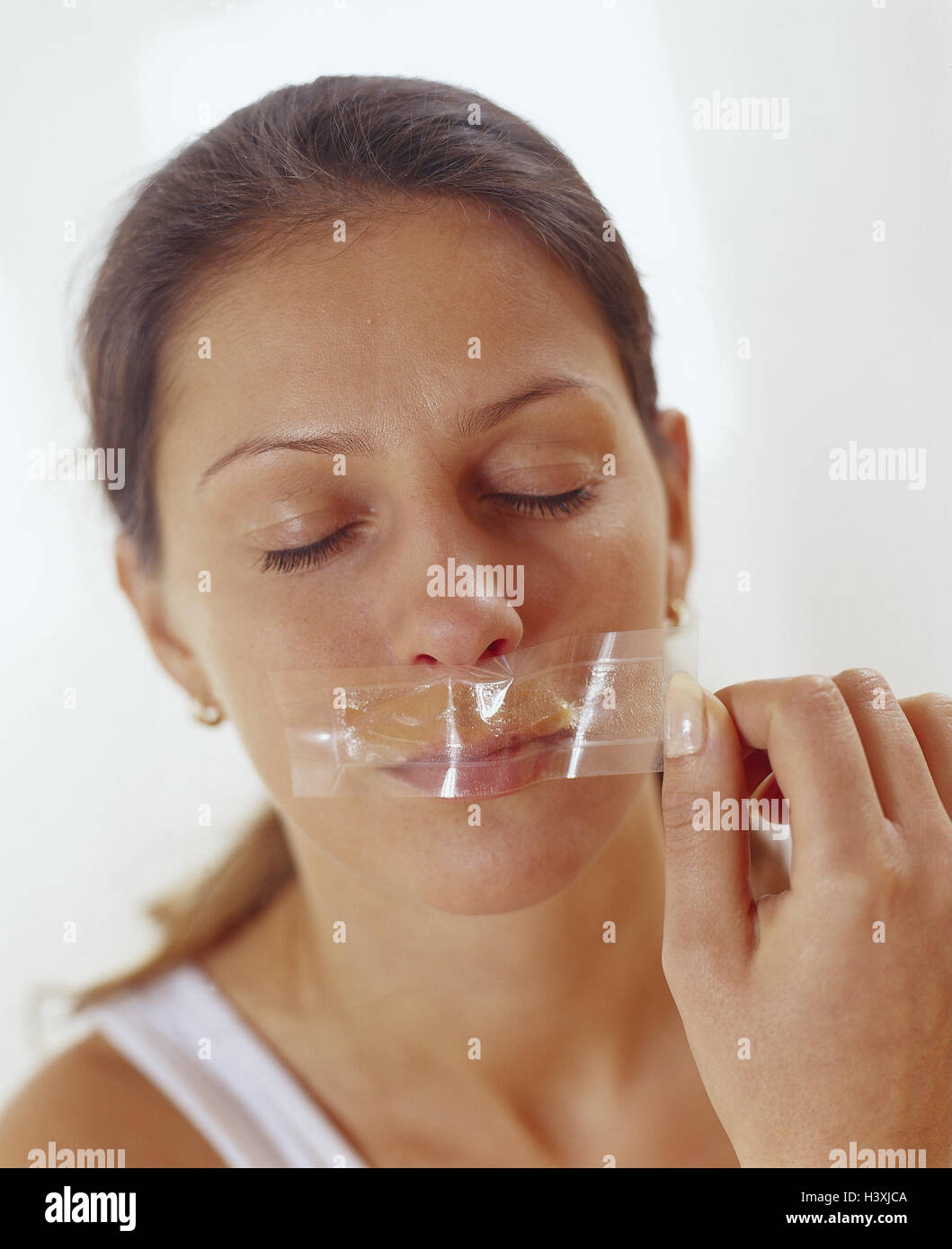 Woman, depilation, upper lip, wax film, pull, portrait, model released