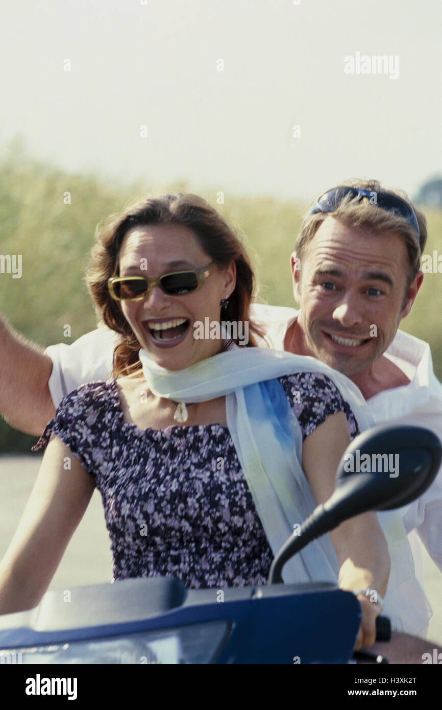 Couple, motor scooter, happy, half portrait, street, scooter, drive