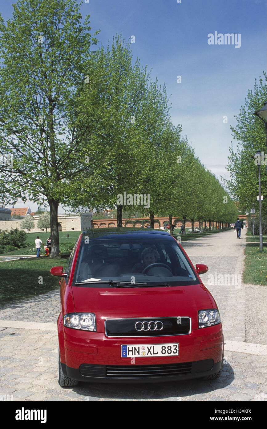 Street, avenue, car, driver trees, autotype, Audi, A2, red, passenger car, new carriage, woman, motoring, drive, shoulder view Stock Photo