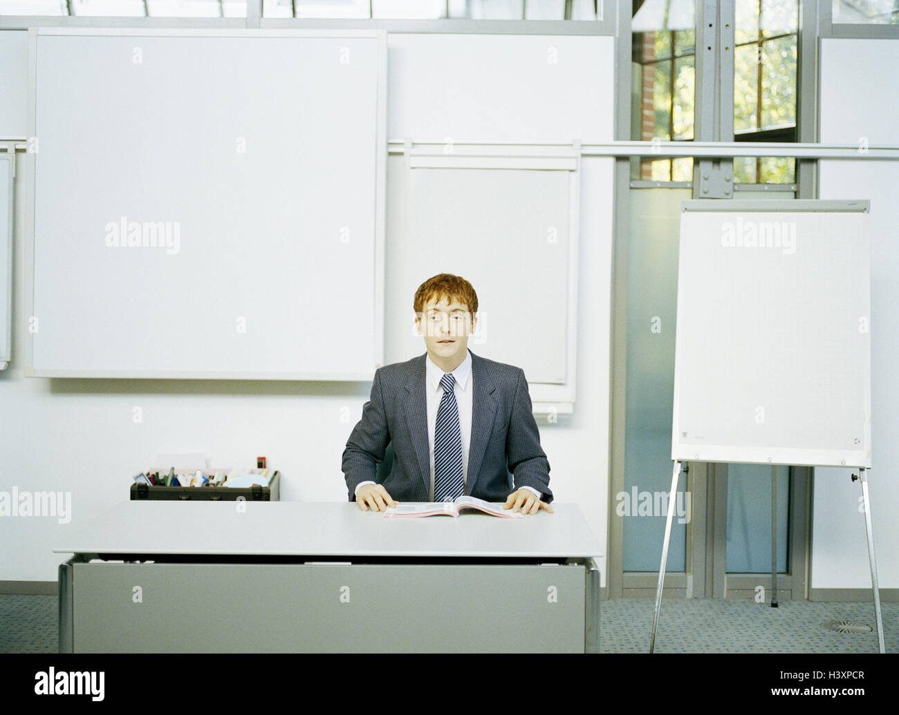 Classrooms, notice board, teacher, inform, business, businessman, man, seminar conductor, seminar, school, lessons, course, perform, information, explanation, education, presentation, training, self-confidently, confidently, occupation Stock Photo