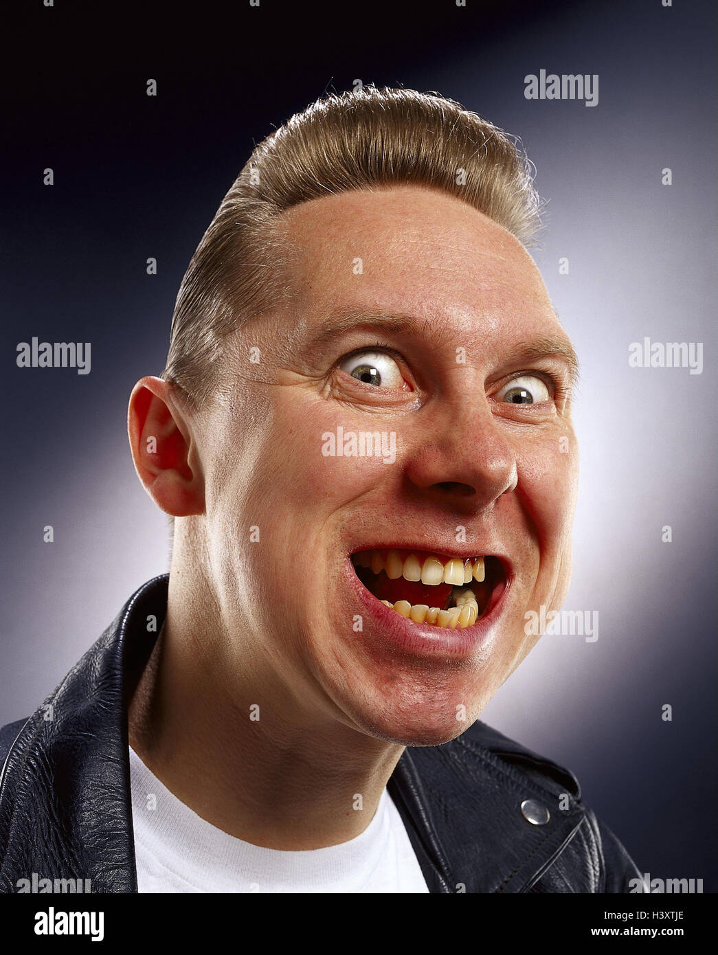 Man, laugh young, leather ball jacket, facial play, nasty, gloating, portrait, Men, studio, hairs, blond, grimace, joy, view, moves, chaotically, crazily, malicious pleasure, near, Stock Photo