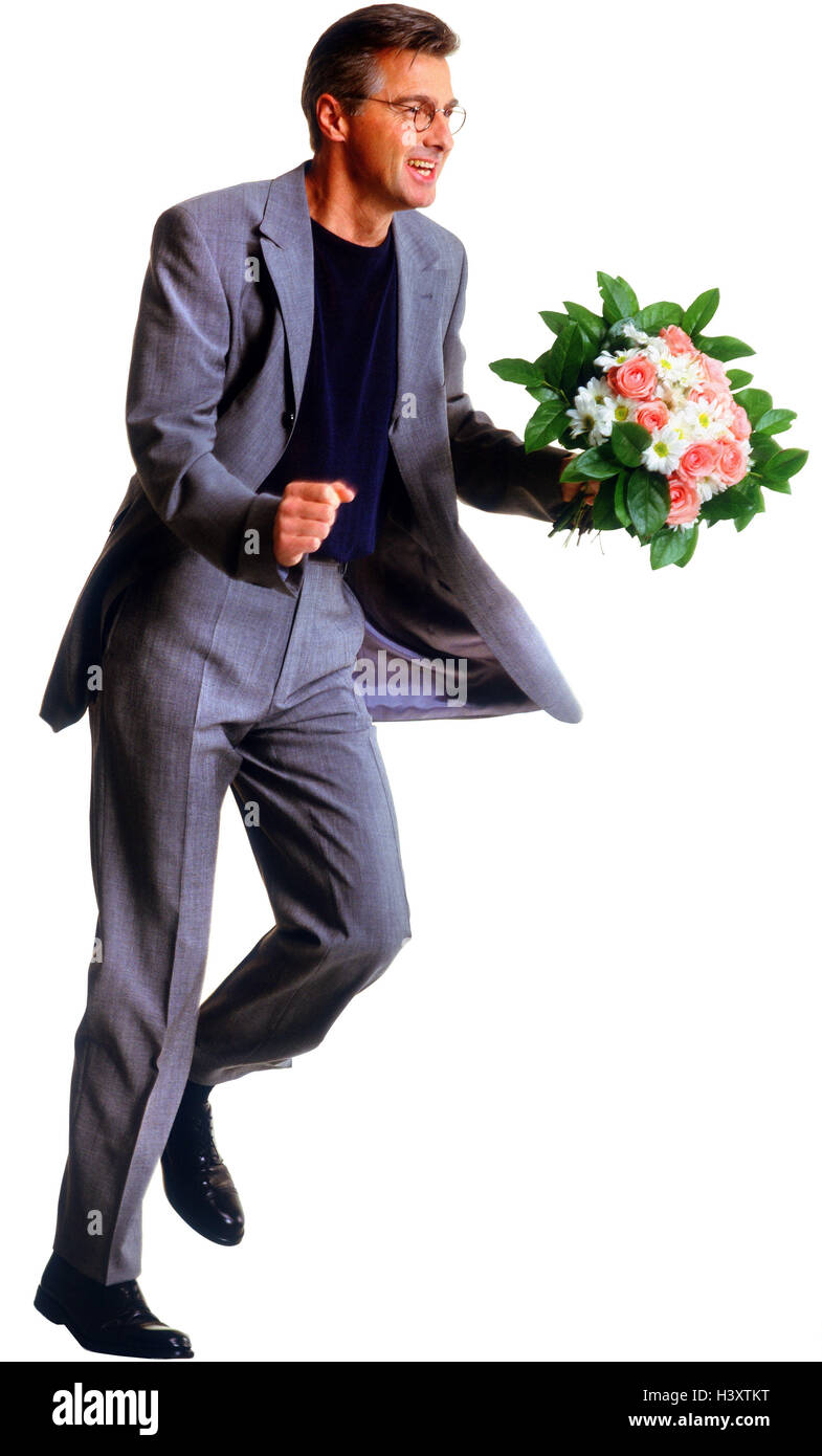 Man, suit, bouquet, happy, motion, run Men, man, flowers, present, surprise, laugh, joy, enthusiasm, haste, date, engagement, side view, studio, cut out, Stock Photo