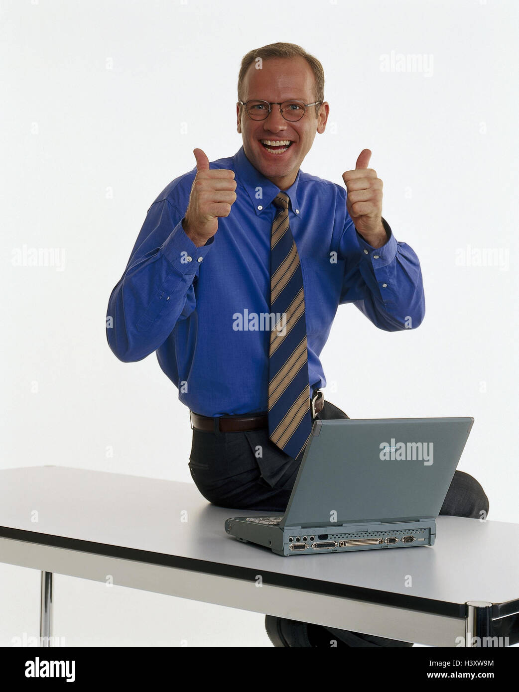 Businessman, young, laptop, gesture, success, table, sit, professions, studio, cut out, notebook computer, successfully, enthusiasm, enthusiastically, joy, pollex high, Stock Photo