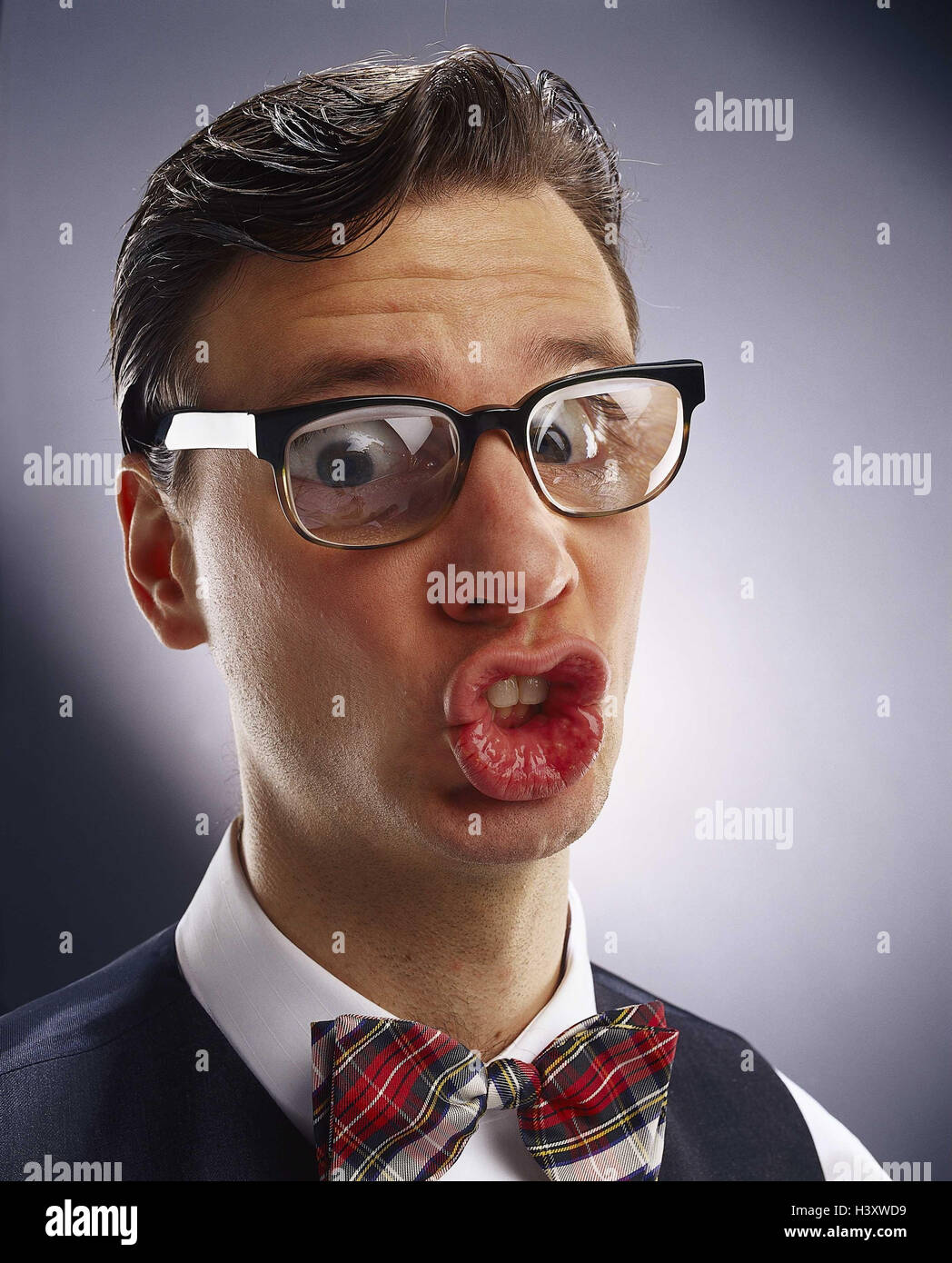 Man, young, glasses, lenses, strongly, facial play, grimace, portrait, Men, shirt, fly, petty bourgeois, lips, 'Schnute', stupidly, funnily, strangely, fun, joke, studio, Stock Photo