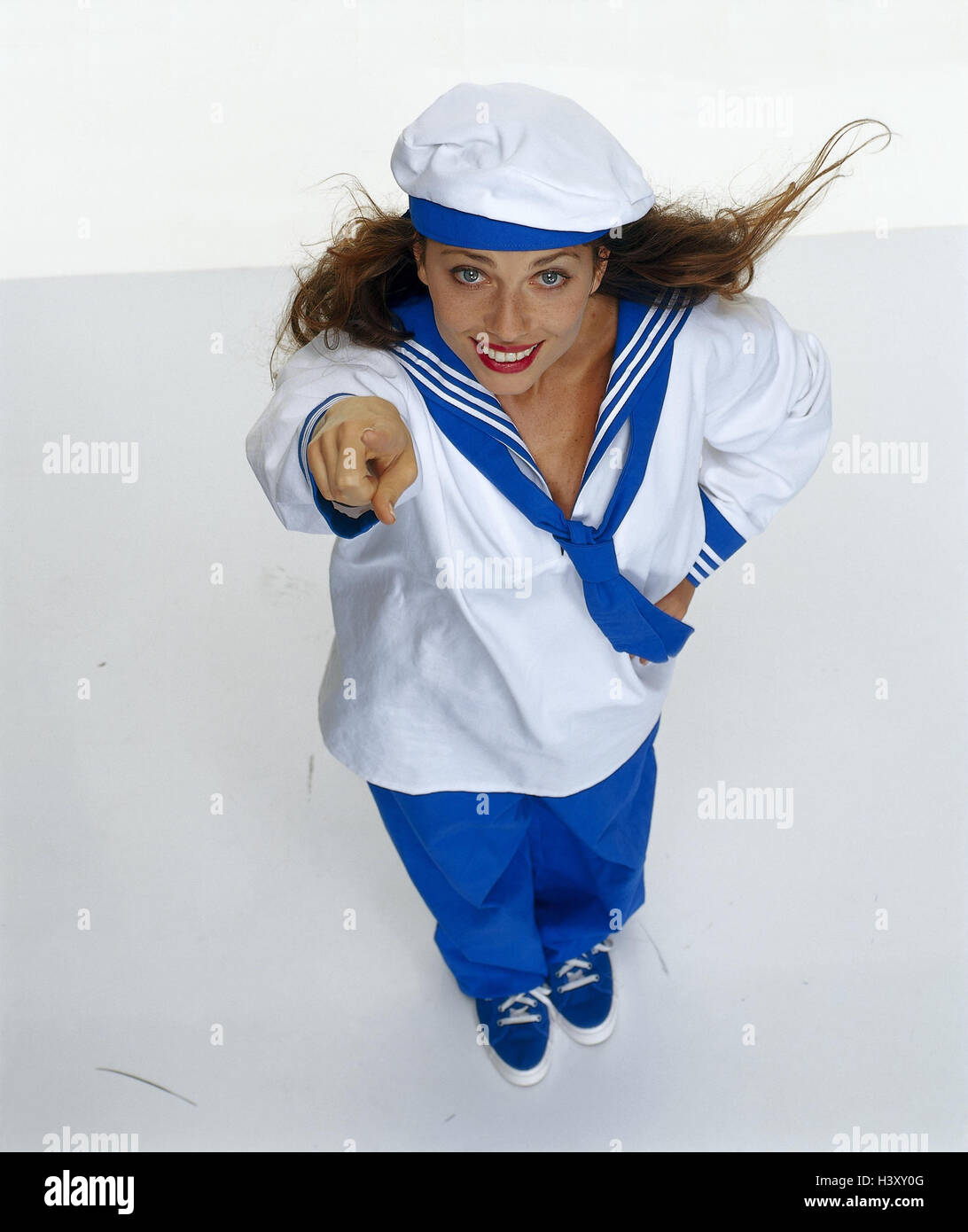 Woman, young, lining, sailor, gesture, pointing, from above, professions, studio, cut outs, hand figures, forefingers, indicate, point, tip, perspective, whole bodies, Stock Photo