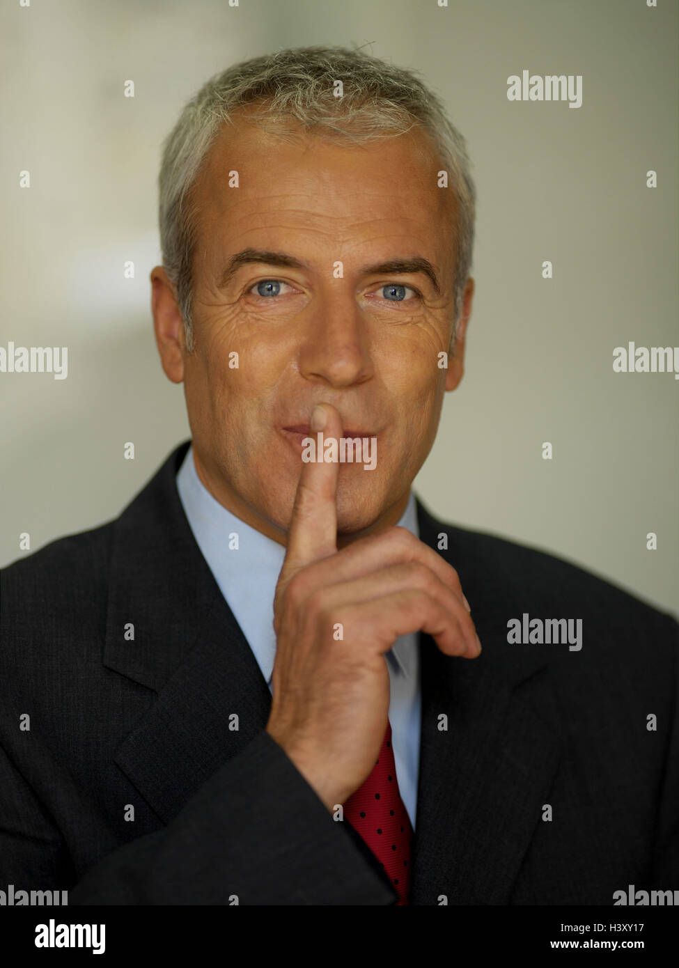 Man, grey-haired, middle old person, suit, gesture, 'silence', portrait,  businessman, Manager, blue eyes, grey hair, gray hair, little laughter  lines, friendly, charmingly, sympathetically, mischievously, cultivated,  seriously, gesture, icon, 