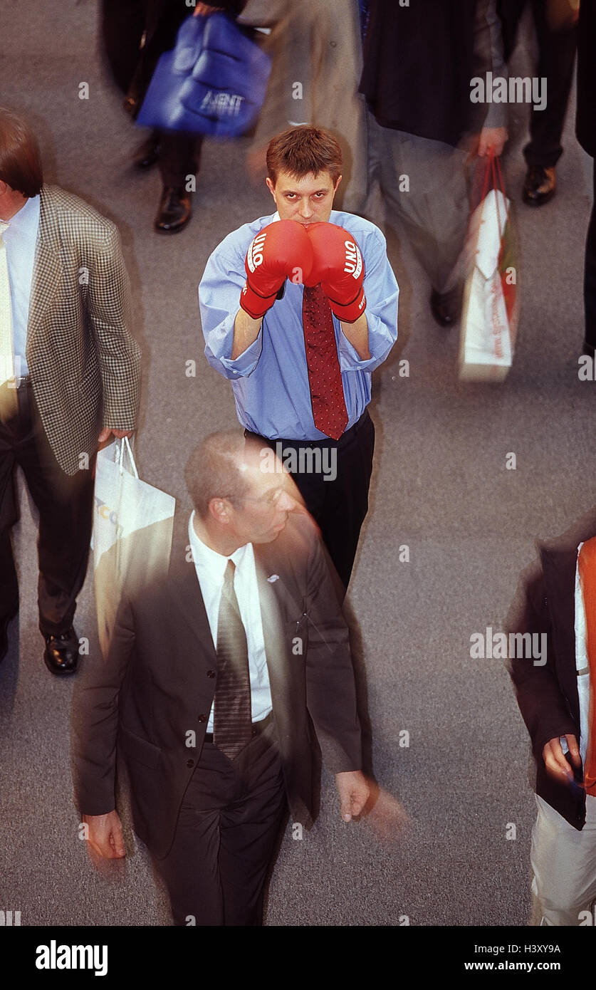 Stock exchange, passer-by, manager, boxing gloves, gesture, aggressively, man, businessman, fighter, fight readiness, fight, through attack, force, facial play, commercial stalls, stock trade, stock exchange transactions, blur, motion, helped to pull Stock Photo