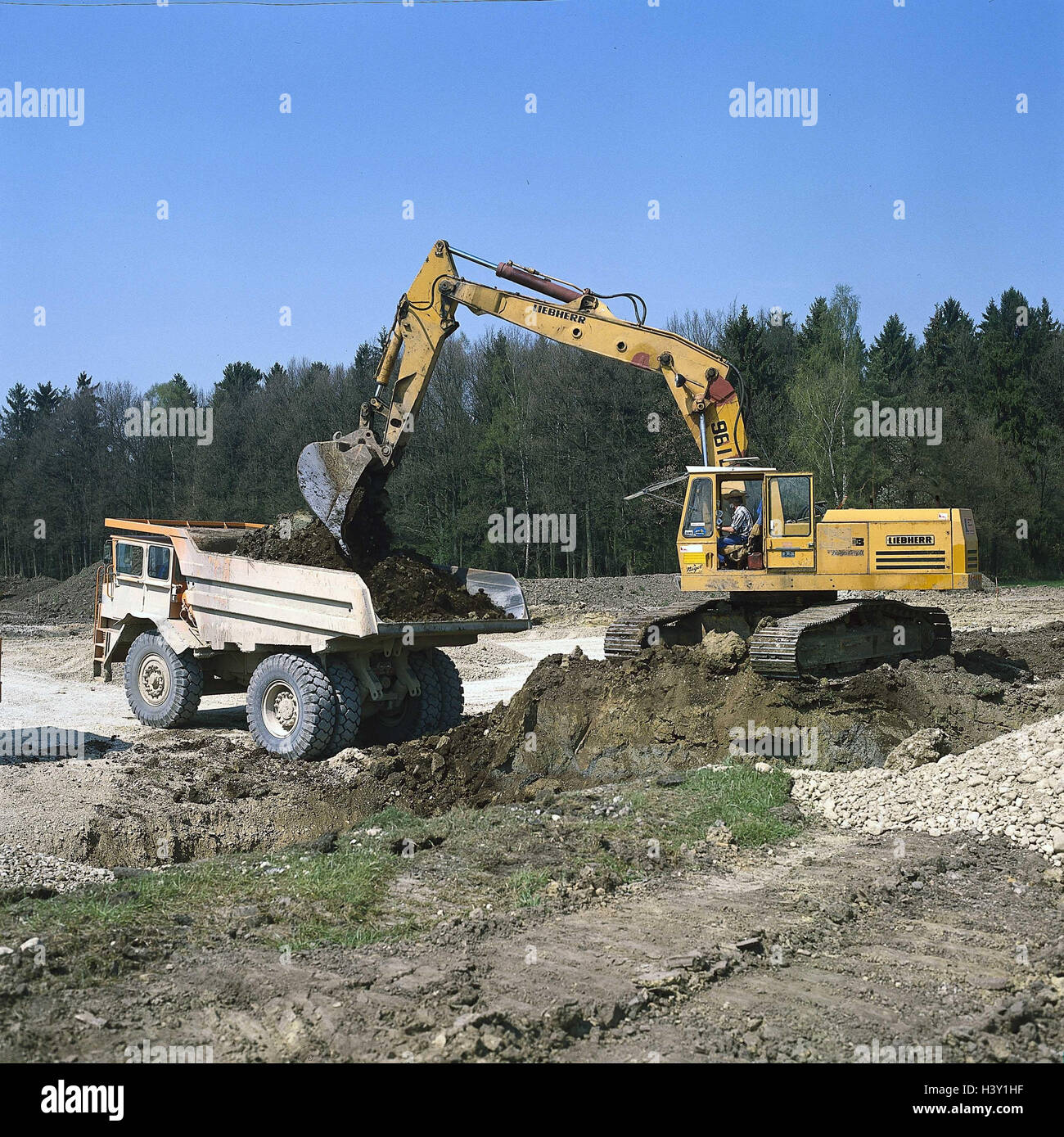 Road construction, truck, excavator, loading, construction machines ...