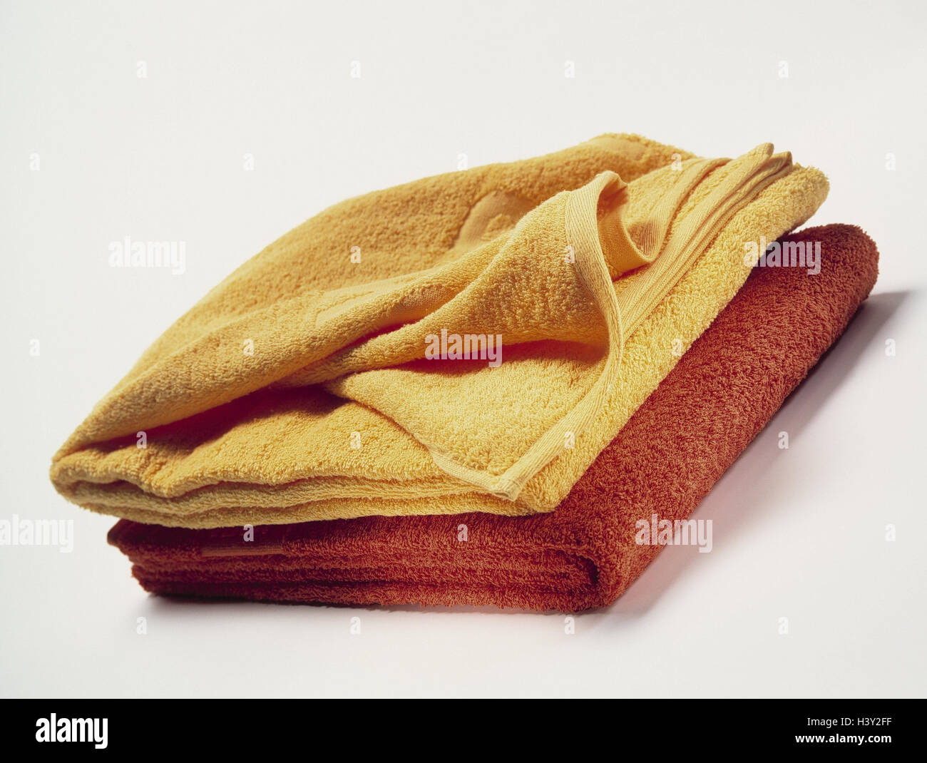 Towels, colours, passed away, stacked towelling cloths, towelling towels, yellow, red, batch, on each other, order, substantially, disorderly, folded up, textiles, textiles, household, product photography, Still life, studio Stock Photo