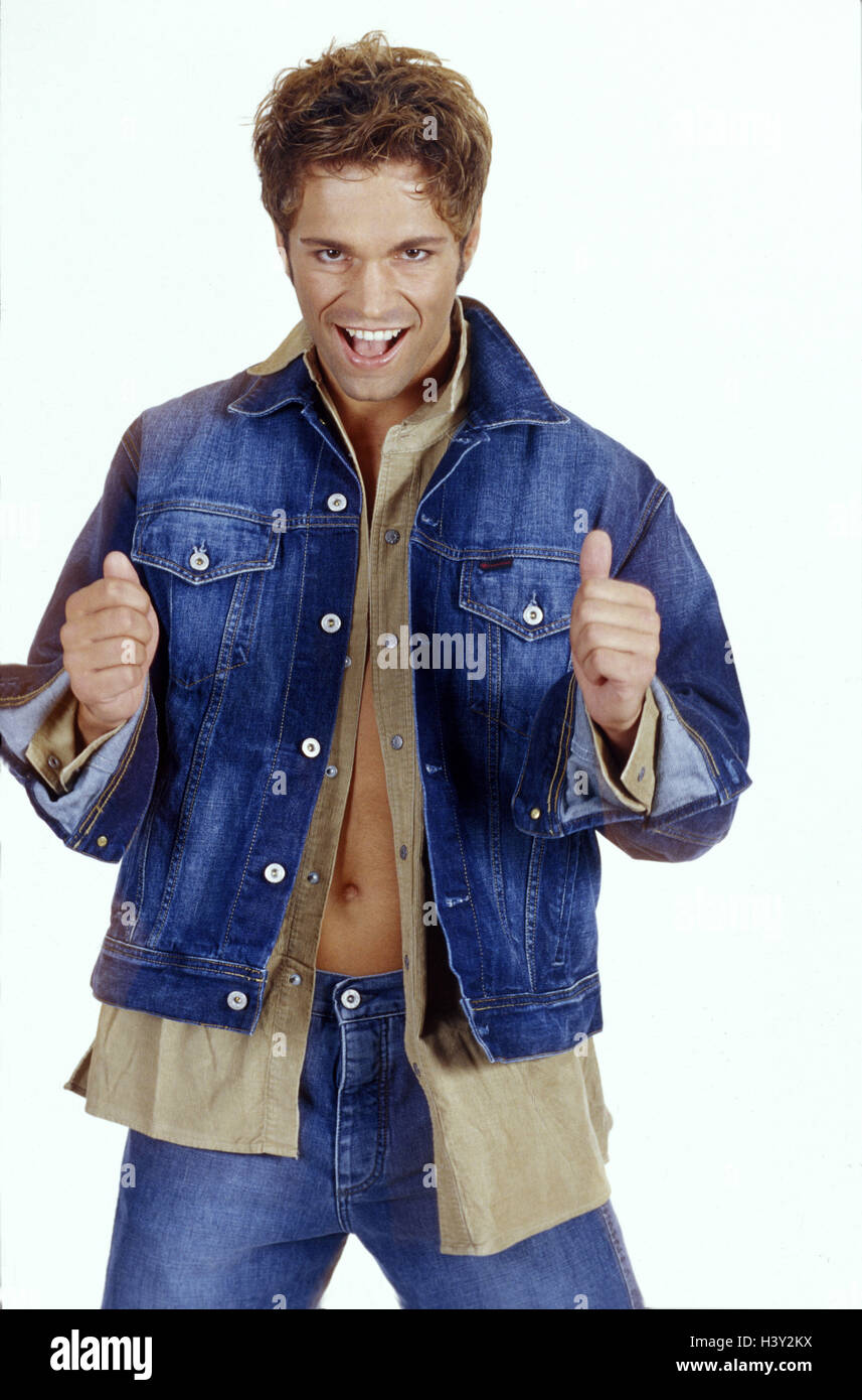 Man, confidently, gesture, OK studio, inside, cut outs, young, jeans, denim jacket, shirt, openly, self-assurance, self-confidently, self-confidence, smile, attractively, attraction, pollex high, everything in order, okay, success, successfully Stock Photo