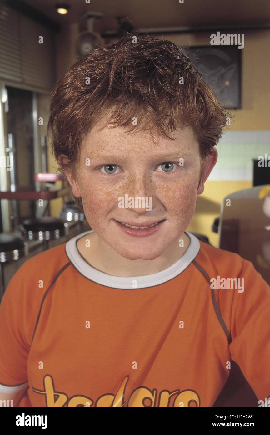 Locally, boy, freckles, portrait, bar, inside, child, 8 years, red-haired, happy, smile, contently, satisfaction Stock Photo