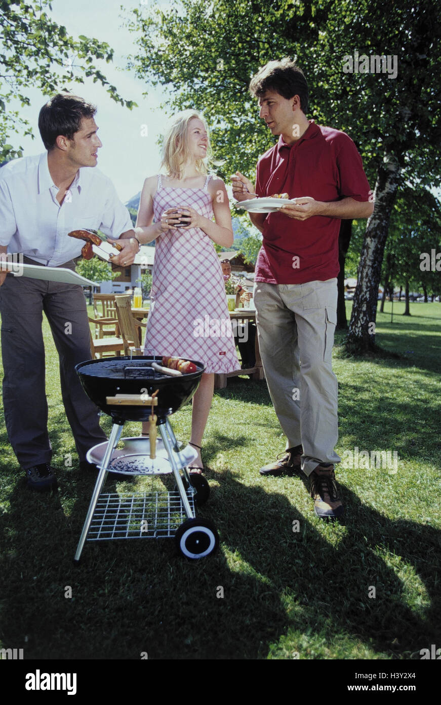 Garden, grill party, guests, conversation, grill, leisure time, garden party, group, guests, men, woman, clique, friends, three, stand, eat, drink, have of a barbecue, garden grill, summers, outside Stock Photo