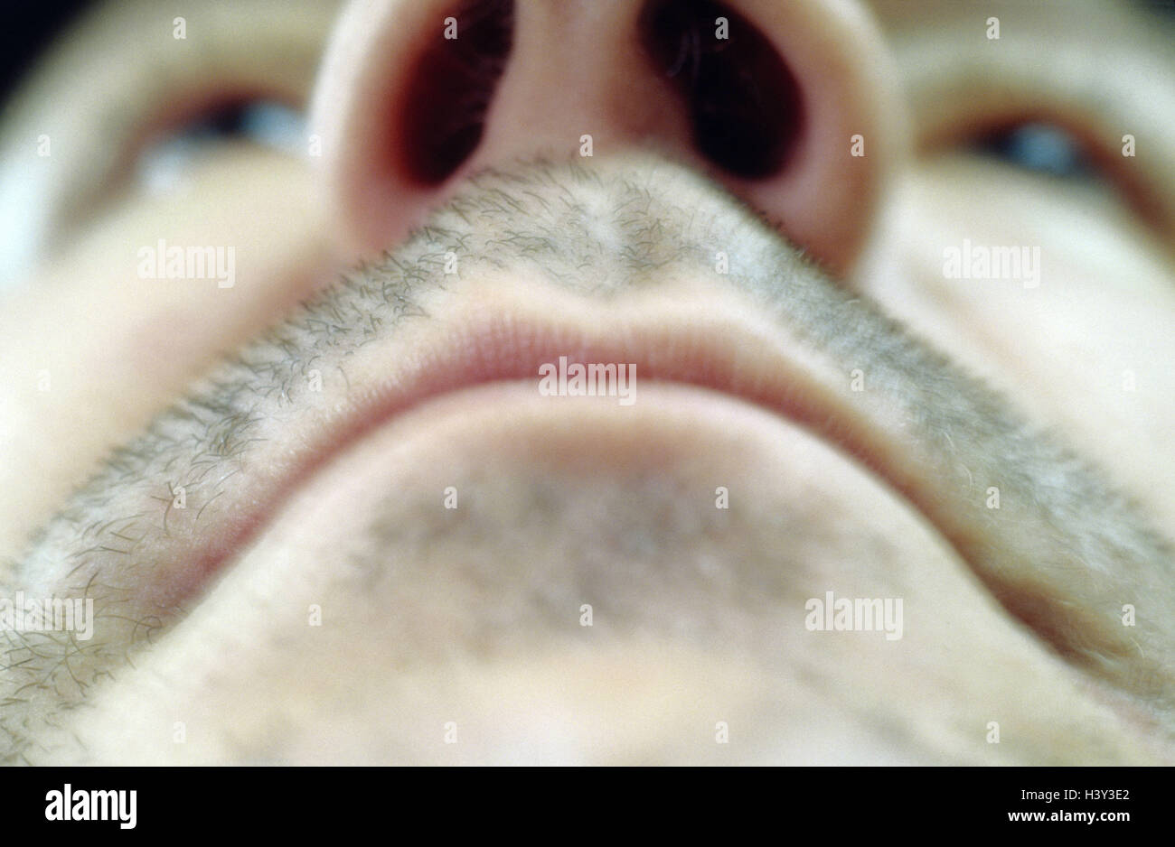 Man, look, area around the mouth, nose, eyes, from below