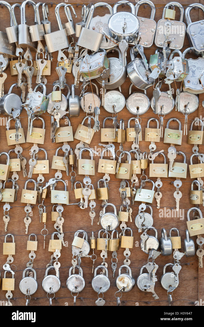 Brass padlocks and keys for sale in a locksmith's shop, Nepal Stock Photo