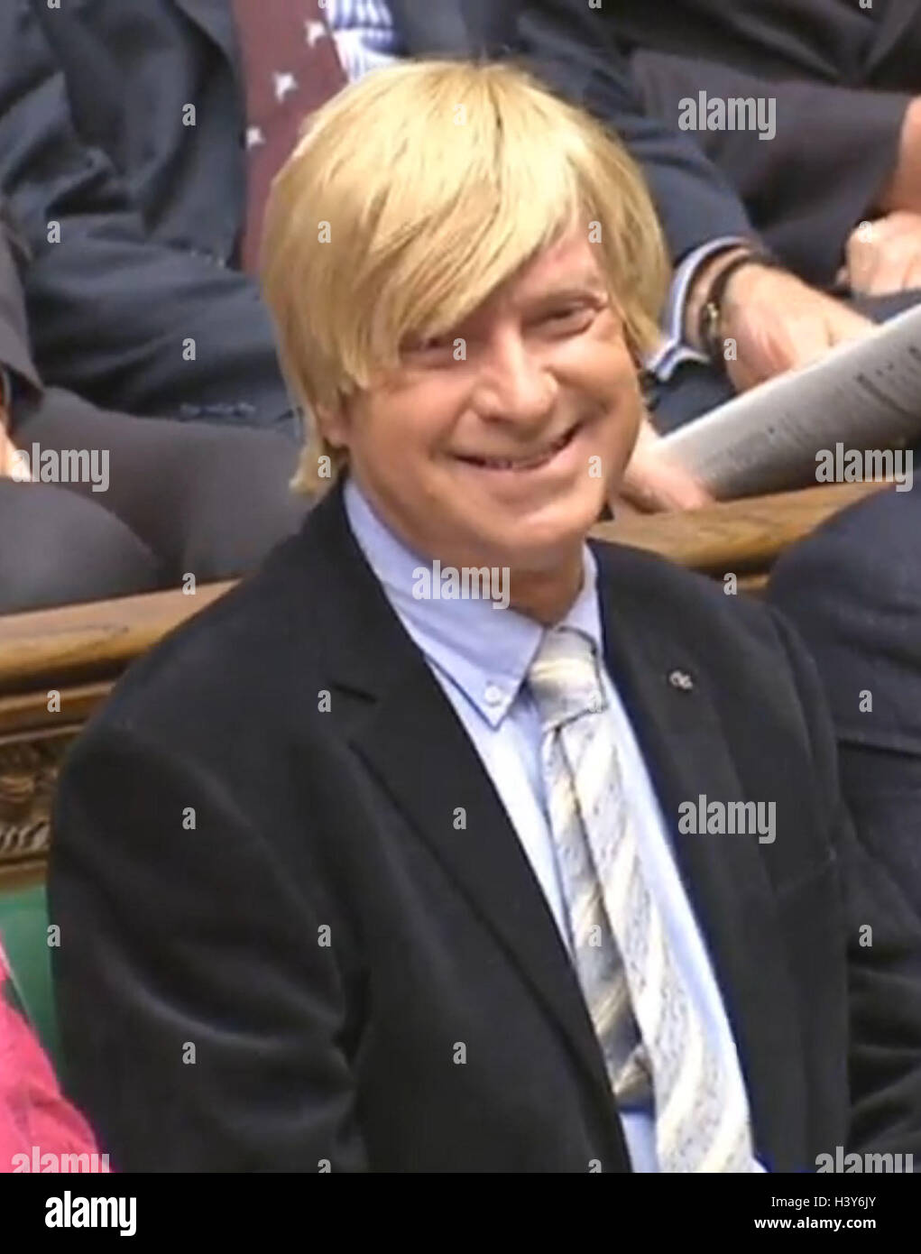 Conservative MP Michael Fabricant smiles during Prime Minister's Questions in the House of Commons, London, after he announced he has been successfully treated for prostate cancer. Stock Photo